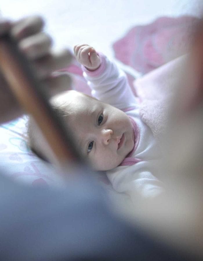 Close-up of a baby's hands being held